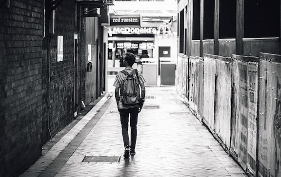 image of someone walking in an alley