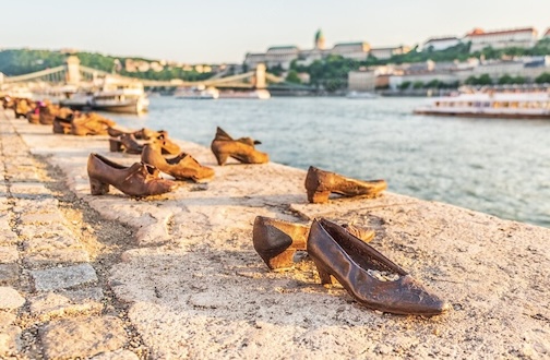 Shoes on the Danube, Buda Castle (background)